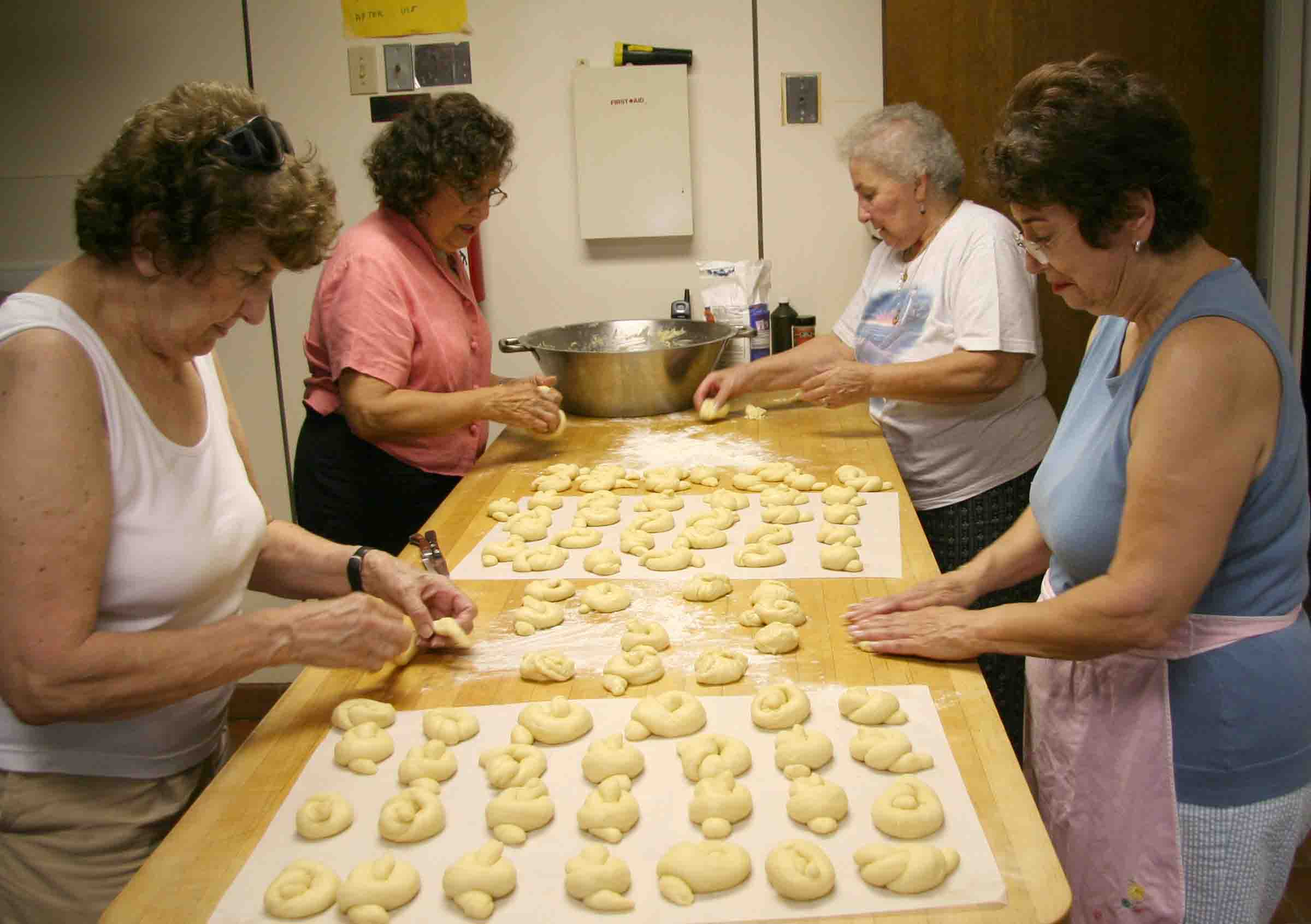 Local women prepare forty dozen choereg, a traditional Armenian sweet roll, for the Armenian Fest held in Springfield, MA. 